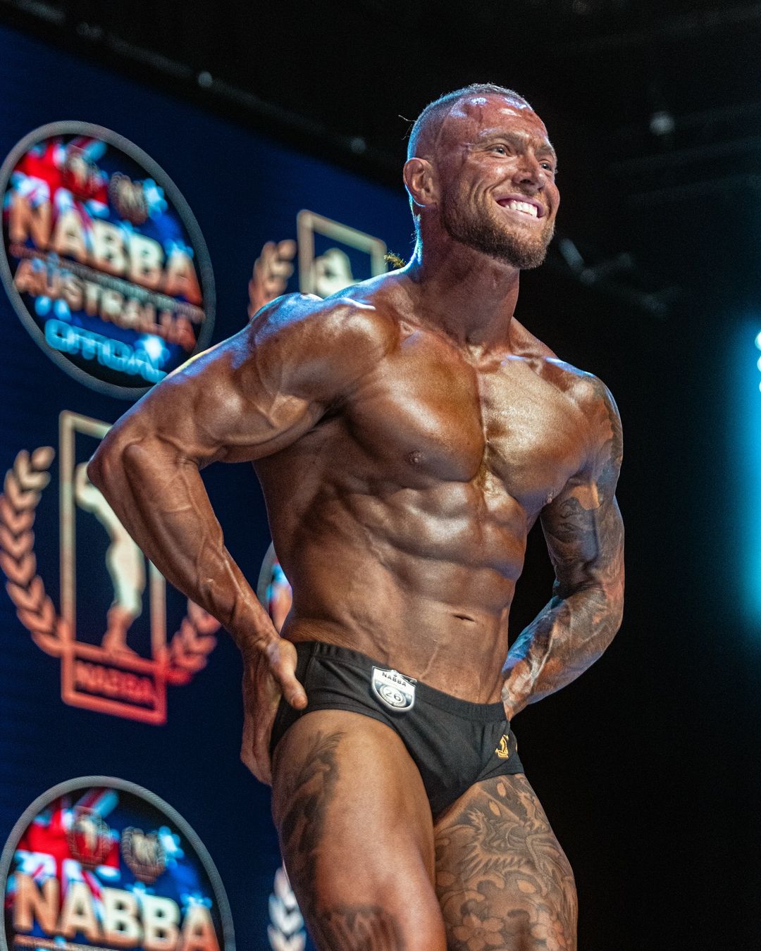 Grant Bourke competing on stage at the NABBA Australia national final